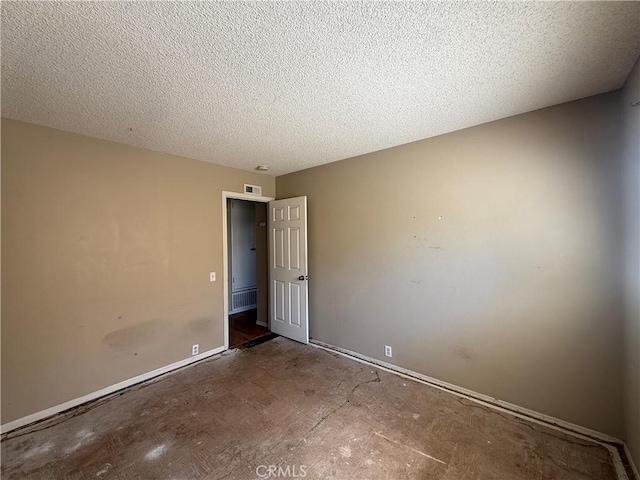 2854 Coronado Ave, San Diego, CA 92154 - unfurnished room featuring baseboards and a textured ceiling