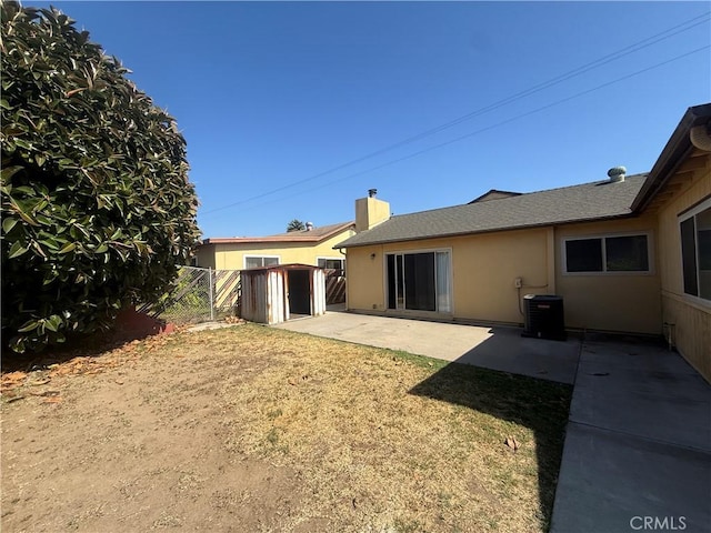 2854 Coronado Ave, San Diego, CA 92154 - back of house featuring a storage unit, a patio, stucco siding, and roof with shingles