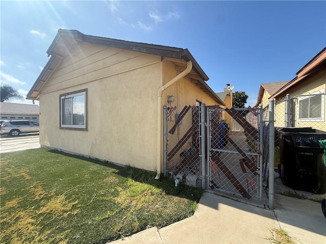 2854 Coronado Ave, San Diego, CA 92154 - view of side of home with a gate and stucco siding