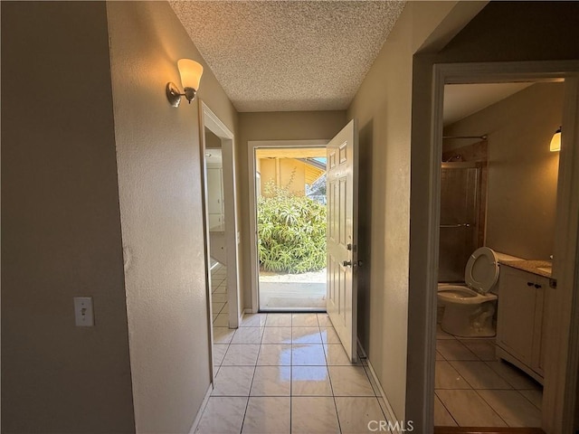 2854 Coronado Ave, San Diego, CA 92154 - doorway featuring a textured ceiling, light tile patterned floors, and a textured wall
