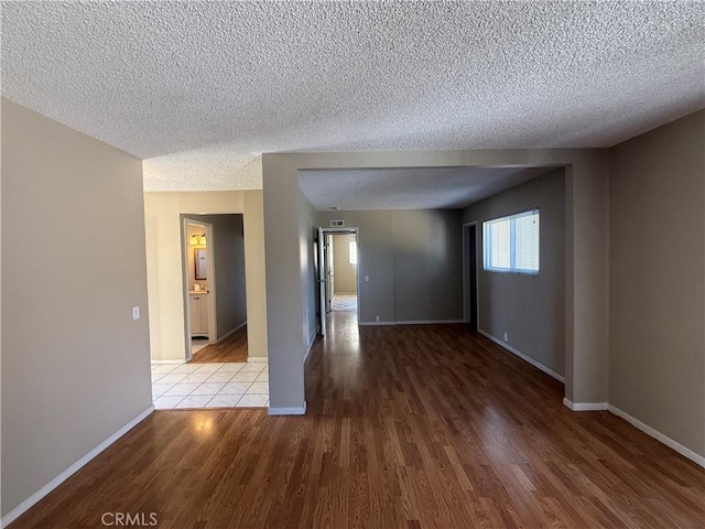 2854 Coronado Ave, San Diego, CA 92154 - empty room with wood finished floors and a textured ceiling