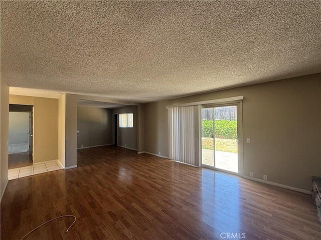 2854 Coronado Ave, San Diego, CA 92154 - spare room with wood finished floors, healthy amount of natural light, and a textured ceiling