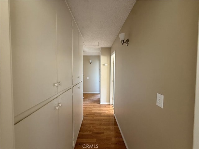 2854 Coronado Ave, San Diego, CA 92154 - corridor featuring a textured ceiling and wood finished floors