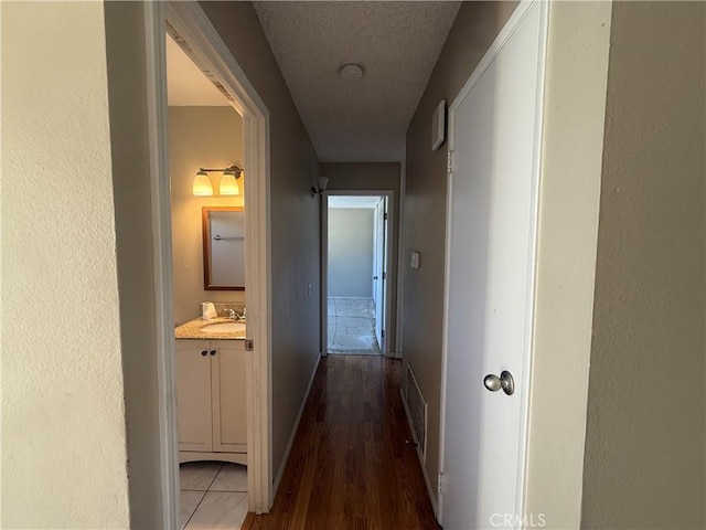 2854 Coronado Ave, San Diego, CA 92154 - hall featuring wood finished floors and a sink