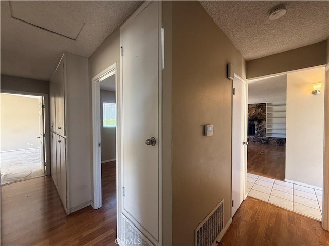 2854 Coronado Ave, San Diego, CA 92154 - corridor featuring wood finished floors and a textured ceiling
