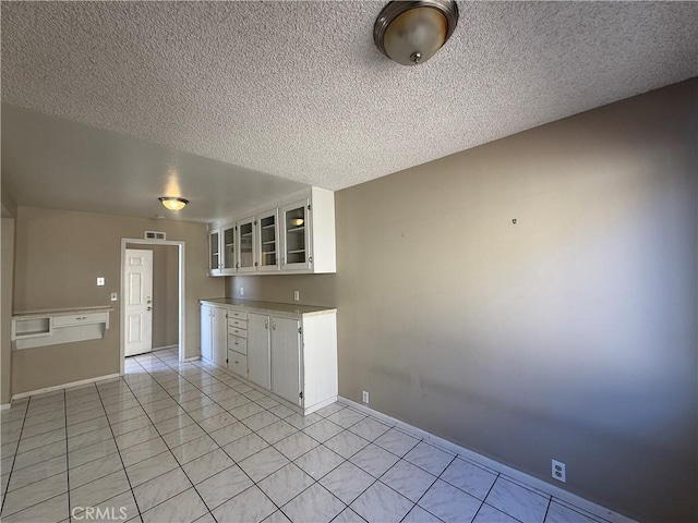 2854 Coronado Ave, San Diego, CA 92154 - unfurnished room with light tile patterned floors and a textured ceiling