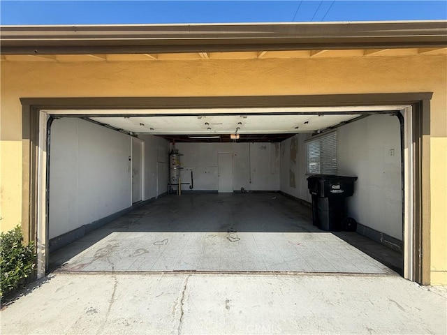 2854 Coronado Ave, San Diego, CA 92154 - garage with baseboards and water heater