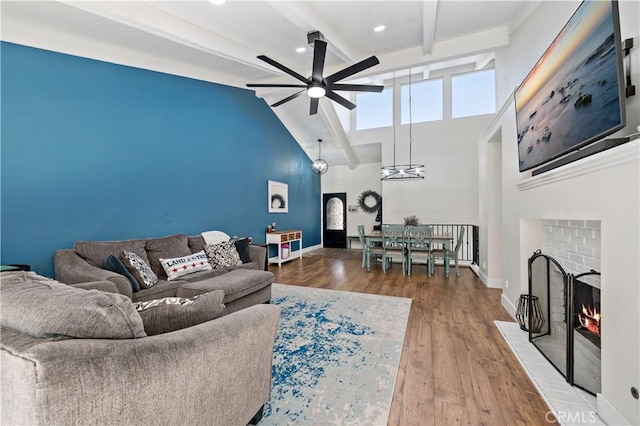 1828 Wintergreen, Escondido, CA 92026 - living room with ceiling fan, beamed ceiling, high vaulted ceiling, wood finished floors, and a fireplace