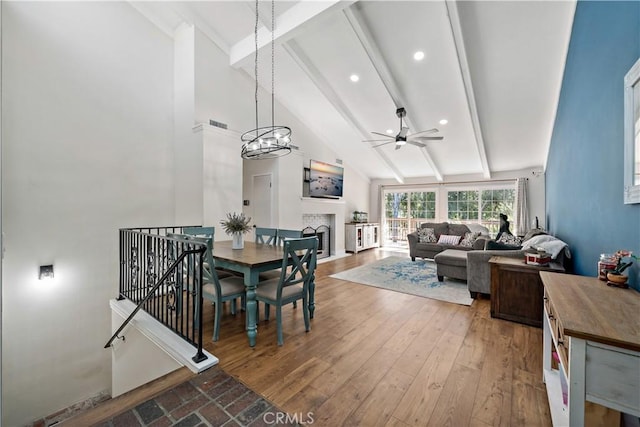 1828 Wintergreen, Escondido, CA 92026 - dining space with a ceiling fan, beamed ceiling, wood finished floors, a fireplace, and recessed lighting
