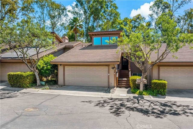 1828 Wintergreen, Escondido, CA 92026 - mid-century inspired home featuring a tile roof, driveway, and a chimney