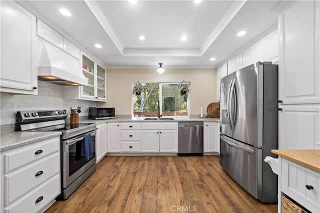 1828 Wintergreen, Escondido, CA 92026 - kitchen with stainless steel appliances, custom exhaust hood, dark wood finished floors, glass insert cabinets, and tasteful backsplash