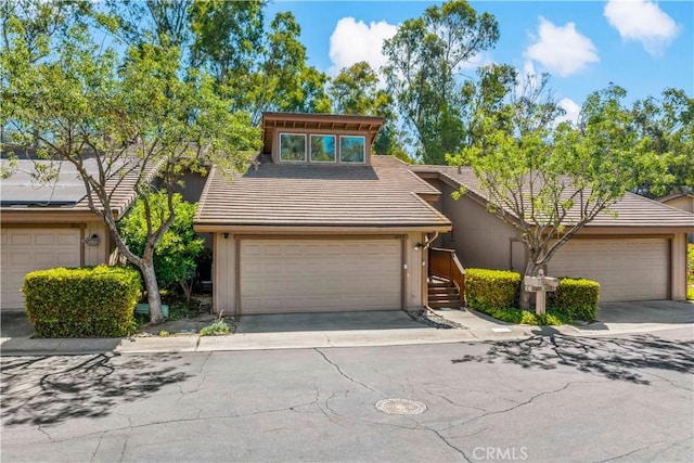 1828 Wintergreen, Escondido, CA 92026 - mid-century modern home with a tiled roof and driveway