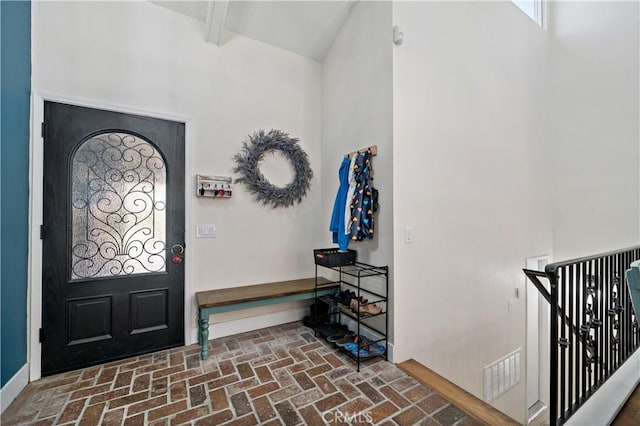 1828 Wintergreen, Escondido, CA 92026 - foyer entrance featuring brick flooring, beamed ceiling, plenty of natural light, and high vaulted ceiling