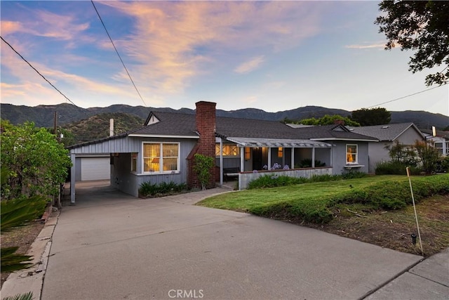 2900 Manhattan Ave, La Crescenta, CA 91214 - view of front of home featuring a mountain view, a chimney, concrete driveway, and a yard