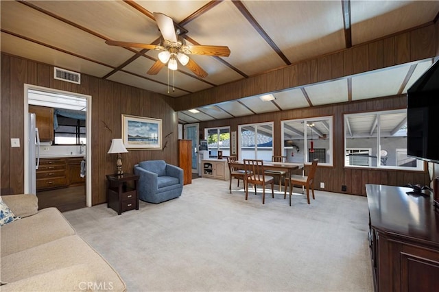 2900 Manhattan Ave, La Crescenta, CA 91214 - living room with a ceiling fan, wooden walls, and light carpet