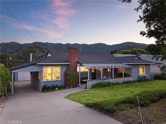 2900 Manhattan Ave, La Crescenta, CA 91214 - view of front of house with a chimney, a mountain view, and a lawn