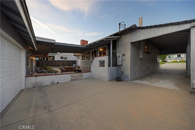 2900 Manhattan Ave, La Crescenta, CA 91214 - view of home's exterior featuring a garage, concrete driveway, and a carport
