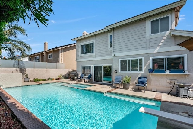 3652 San Joaquin Ave, Los Alamitos, CA 90720 - view of pool featuring a patio, a diving board, and a pool with connected hot tub