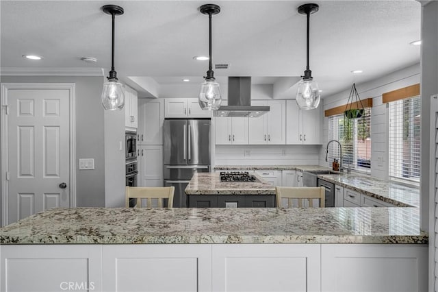 3652 San Joaquin Ave, Los Alamitos, CA 90720 - kitchen featuring appliances with stainless steel finishes, white cabinets, light stone counters, wall chimney exhaust hood, and recessed lighting