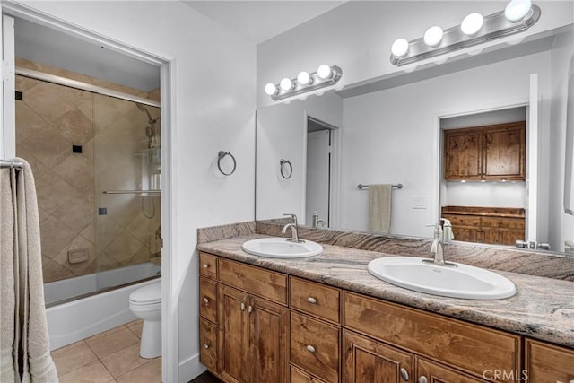 3652 San Joaquin Ave, Los Alamitos, CA 90720 - bathroom with tile patterned flooring, double vanity, and bath / shower combo with glass door