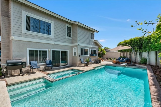 3652 San Joaquin Ave, Los Alamitos, CA 90720 - view of pool featuring a patio area, a fenced backyard, a pool with connected hot tub, and a grill