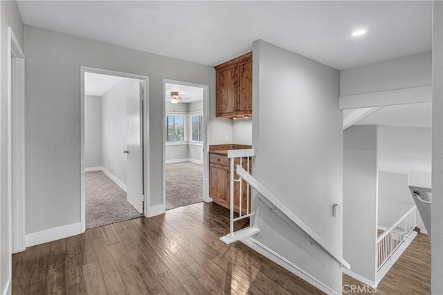 3652 San Joaquin Ave, Los Alamitos, CA 90720 - hallway with an upstairs landing, dark wood finished floors, and recessed lighting
