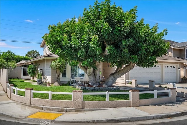 3652 San Joaquin Ave, Los Alamitos, CA 90720 - view of property hidden behind natural elements with a fenced front yard, concrete driveway, and an attached garage