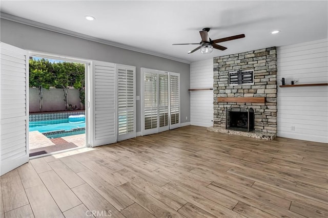 3652 San Joaquin Ave, Los Alamitos, CA 90720 - unfurnished living room with a ceiling fan, healthy amount of natural light, wood finished floors, crown molding, and a fireplace