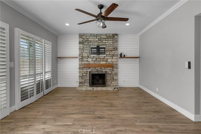 3652 San Joaquin Ave, Los Alamitos, CA 90720 - unfurnished living room featuring crown molding, ceiling fan, a stone fireplace, recessed lighting, and wood finished floors