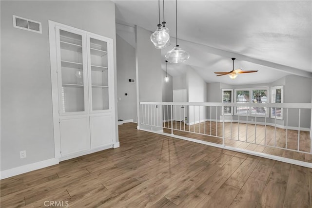 3652 San Joaquin Ave, Los Alamitos, CA 90720 - unfurnished room featuring wood finished floors, lofted ceiling, and a ceiling fan
