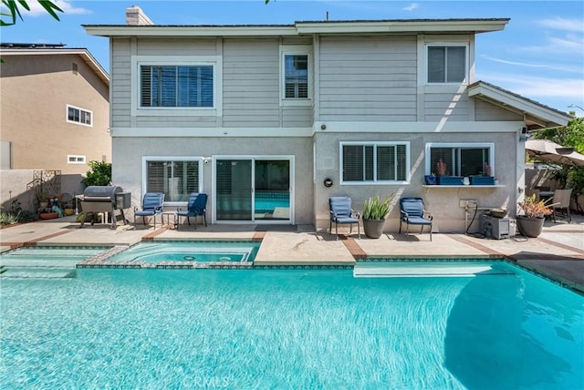 3652 San Joaquin Ave, Los Alamitos, CA 90720 - back of property featuring a patio and stucco siding