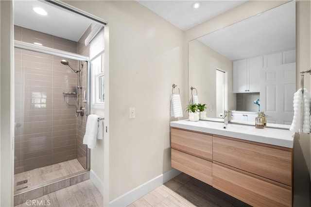 26356 Sorrell Pl, Laguna Hills, CA 92653 - bathroom featuring vanity, tiled shower, and recessed lighting