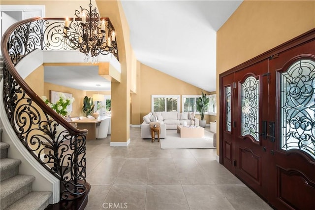26356 Sorrell Pl, Laguna Hills, CA 92653 - entryway with a chandelier, high vaulted ceiling, tile patterned flooring, and stairway