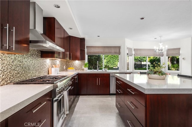 26356 Sorrell Pl, Laguna Hills, CA 92653 - kitchen featuring appliances with stainless steel finishes, wall chimney range hood, decorative backsplash, a chandelier, and recessed lighting
