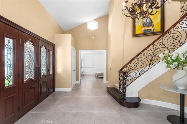 26356 Sorrell Pl, Laguna Hills, CA 92653 - entryway featuring stairs, high vaulted ceiling, a chandelier, light tile patterned floors, and french doors