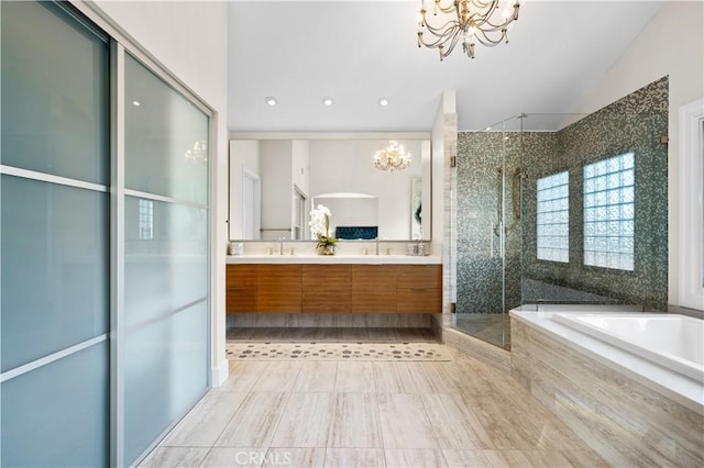 26356 Sorrell Pl, Laguna Hills, CA 92653 - bathroom featuring a chandelier, a shower stall, double vanity, a bath, and vaulted ceiling