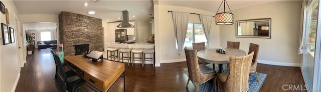 1349 Beech Hill Ave, Hacienda Heights, CA 91745 - dining space featuring wood finished floors, vaulted ceiling, and a stone fireplace