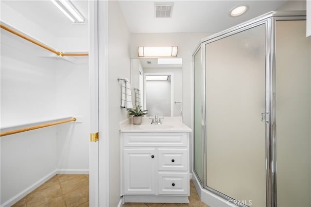 13311 Twin Hills Rd Unit 55H, Seal Beach, CA 90740 - full bathroom with a shower stall, vanity, a spacious closet, and tile patterned floors