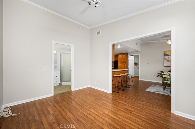 13311 Twin Hills Rd Unit 55H, Seal Beach, CA 90740 - unfurnished living room featuring a ceiling fan, wood finished floors, and crown molding