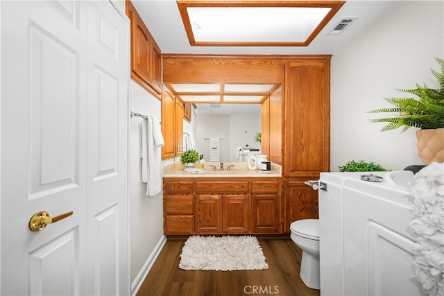 13311 Twin Hills Rd Unit 55H, Seal Beach, CA 90740 - half bath featuring wood finished floors, vanity, and a closet