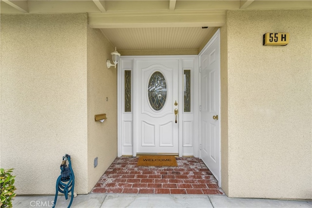 13311 Twin Hills Rd Unit 55H, Seal Beach, CA 90740 - view of exterior entry featuring stucco siding