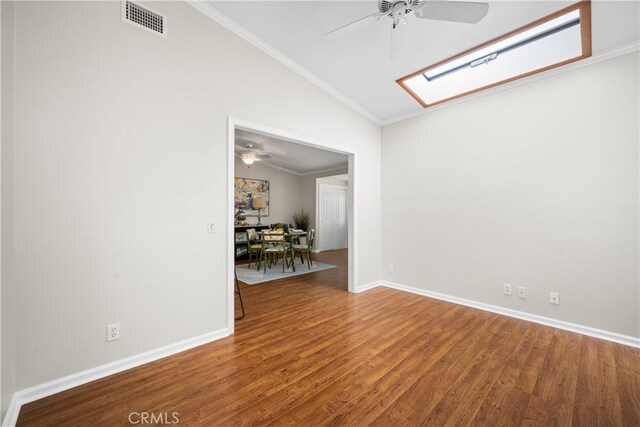 13311 Twin Hills Rd Unit 55H, Seal Beach, CA 90740 - unfurnished room with ceiling fan, lofted ceiling, wood finished floors, ornamental molding, and a skylight