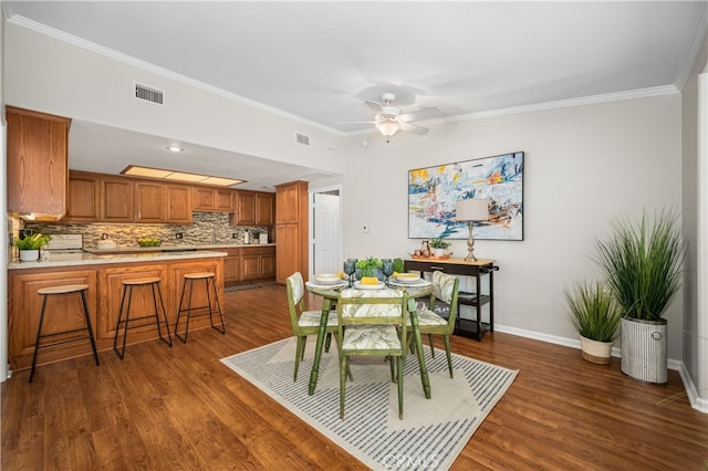 13311 Twin Hills Rd Unit 55H, Seal Beach, CA 90740 - dining area with ornamental molding, dark wood-style floors, and ceiling fan
