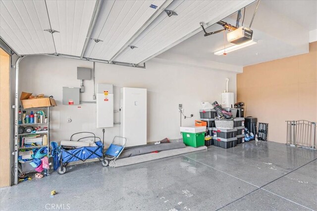 1009 Price Canyon Rd, Pismo Beach, CA 93449 - garage featuring a garage door opener and water heater