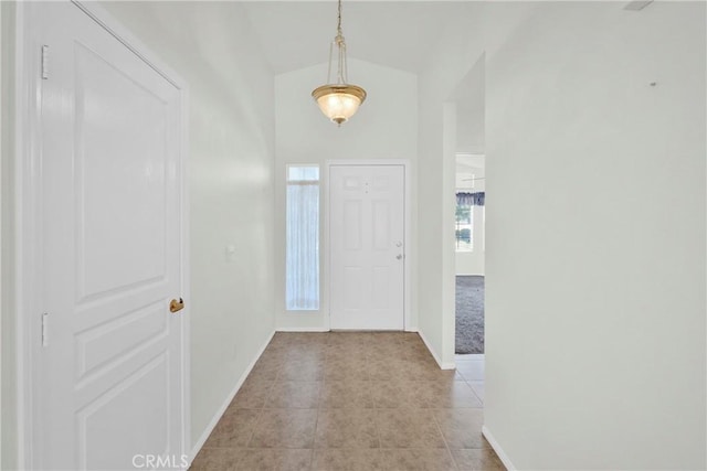 11246 Pleasant Hills Dr, Apple Valley, CA 92308 - foyer entrance featuring light tile patterned flooring, vaulted ceiling, and light colored carpet