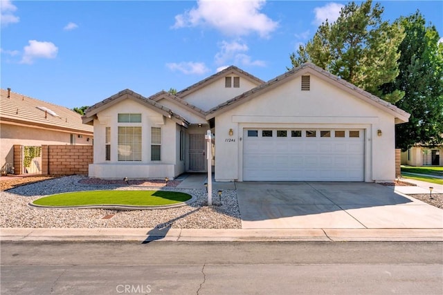 11246 Pleasant Hills Dr, Apple Valley, CA 92308 - single story home with concrete driveway, an attached garage, and stucco siding