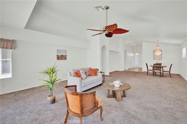 11246 Pleasant Hills Dr, Apple Valley, CA 92308 - living room with arched walkways, carpet, ceiling fan, and lofted ceiling