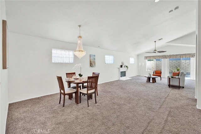 11246 Pleasant Hills Dr, Apple Valley, CA 92308 - carpeted dining area featuring lofted ceiling, a fireplace, and ceiling fan