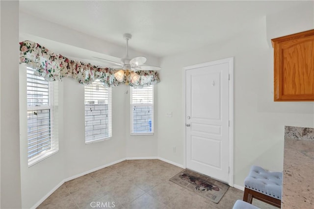 11246 Pleasant Hills Dr, Apple Valley, CA 92308 - unfurnished dining area with ceiling fan and light tile patterned floors
