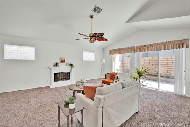 11246 Pleasant Hills Dr, Apple Valley, CA 92308 - carpeted living area with lofted ceiling, a ceiling fan, and a glass covered fireplace